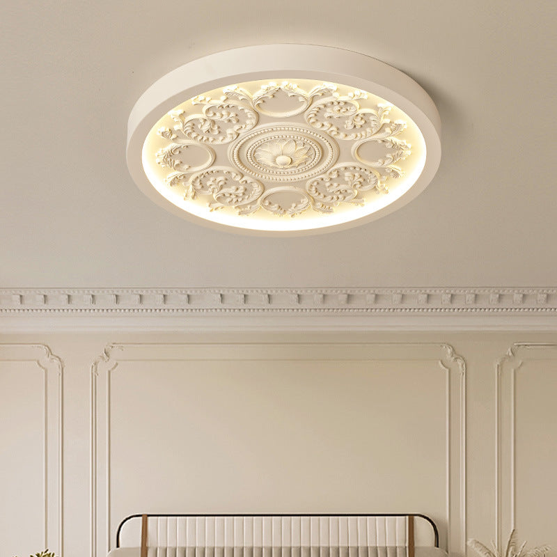 Carved resin flush ceiling light in beige