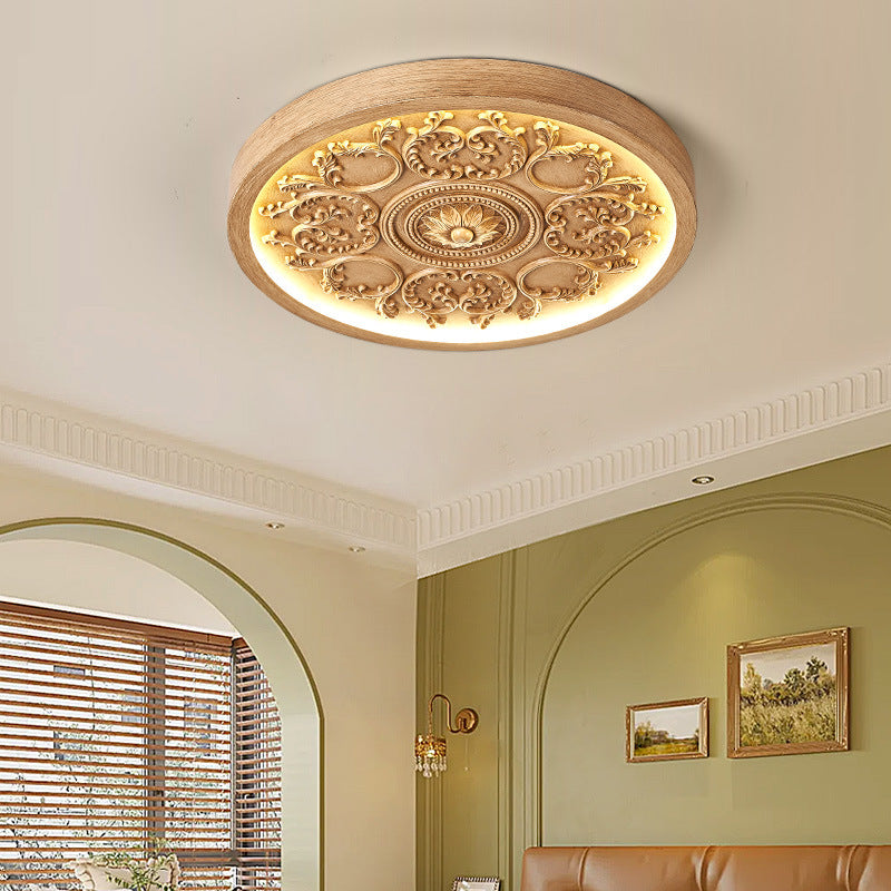 Carved resin flush ceiling light in wood tone