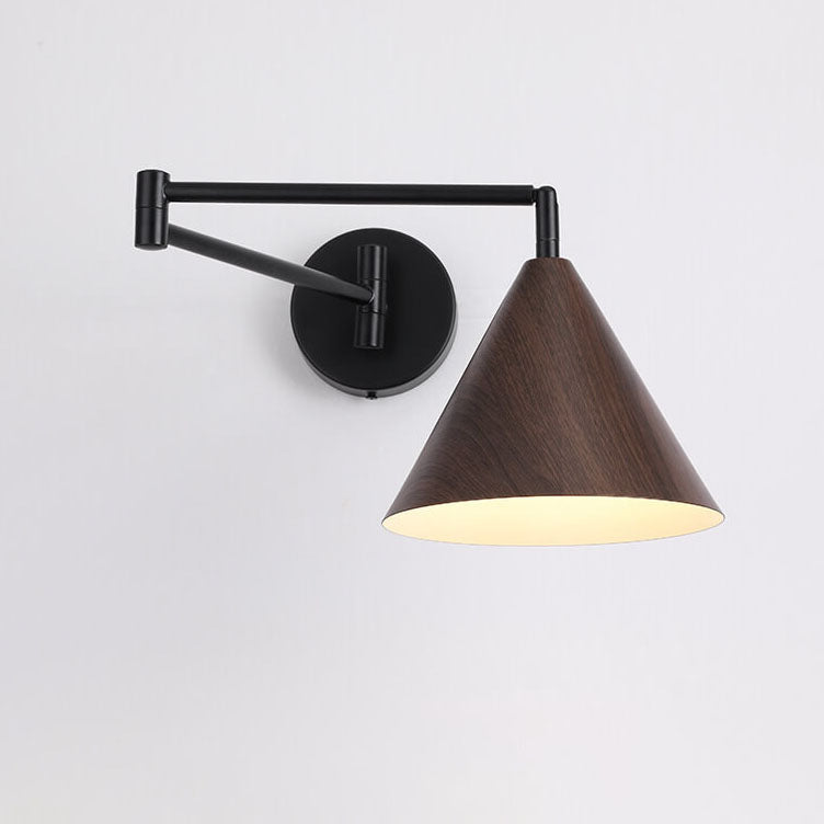 Cone swing arm wall light on bedroom wall