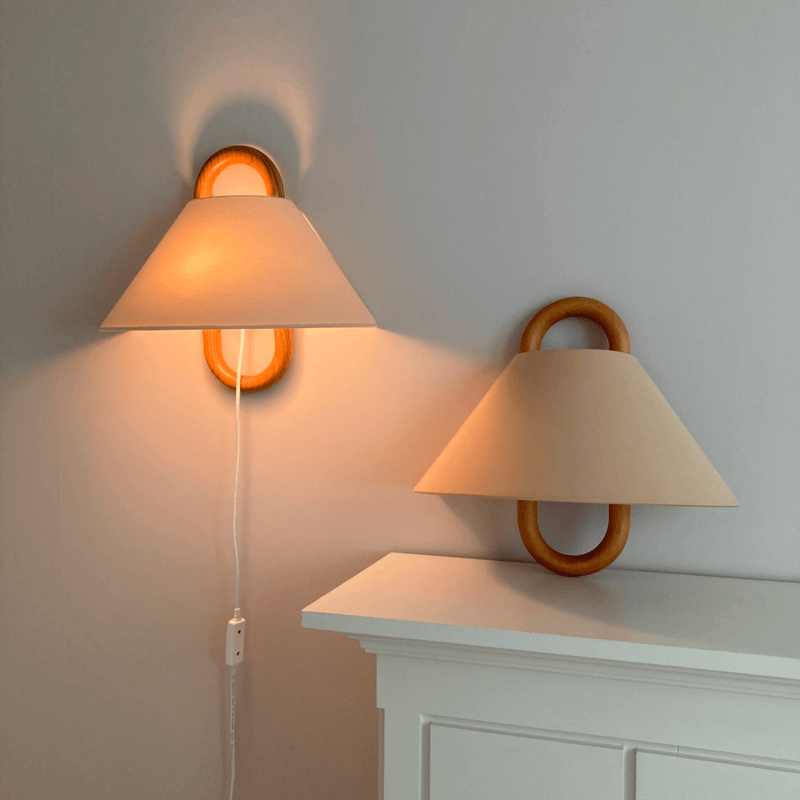 Pleated half-moon wall light on wood bracket