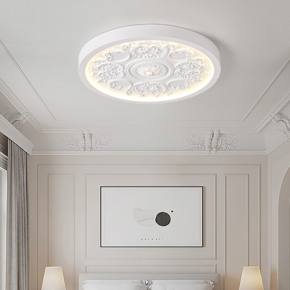 Carved resin LED flush ceiling light on ceiling