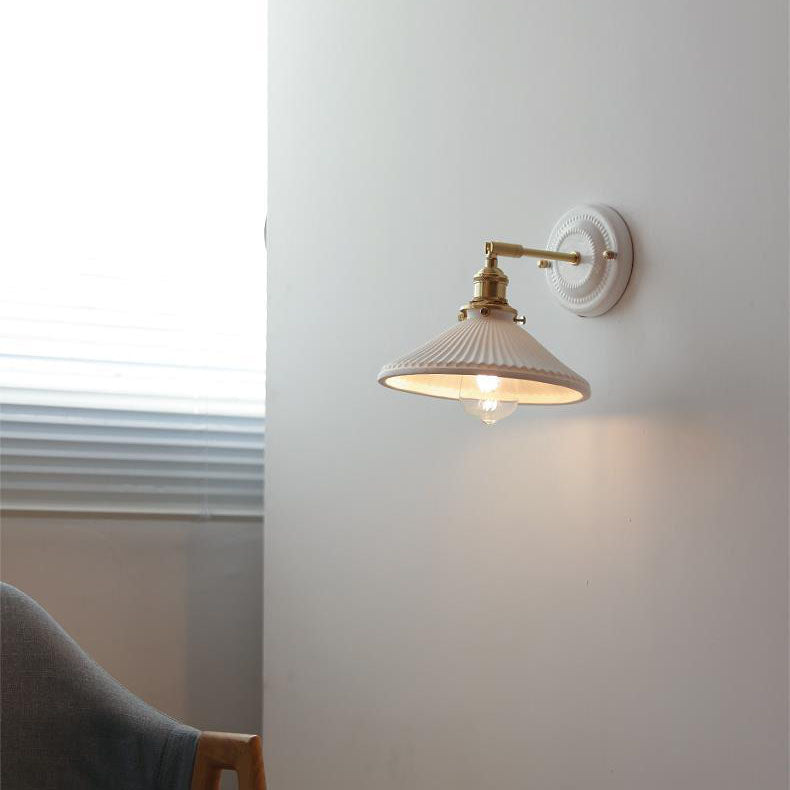 Ceramic wall light on a white wall