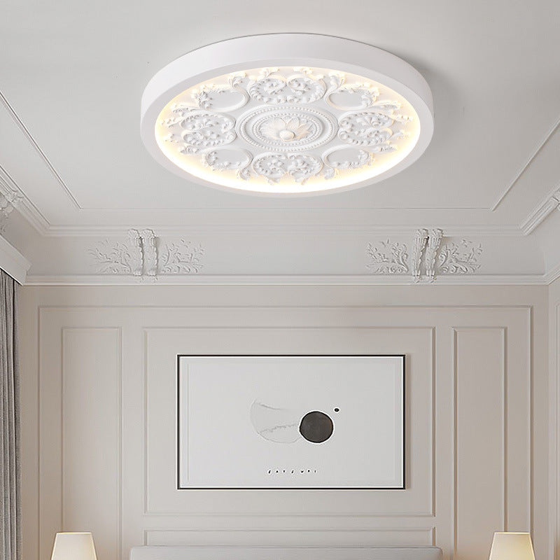 Carved resin flush ceiling light in white