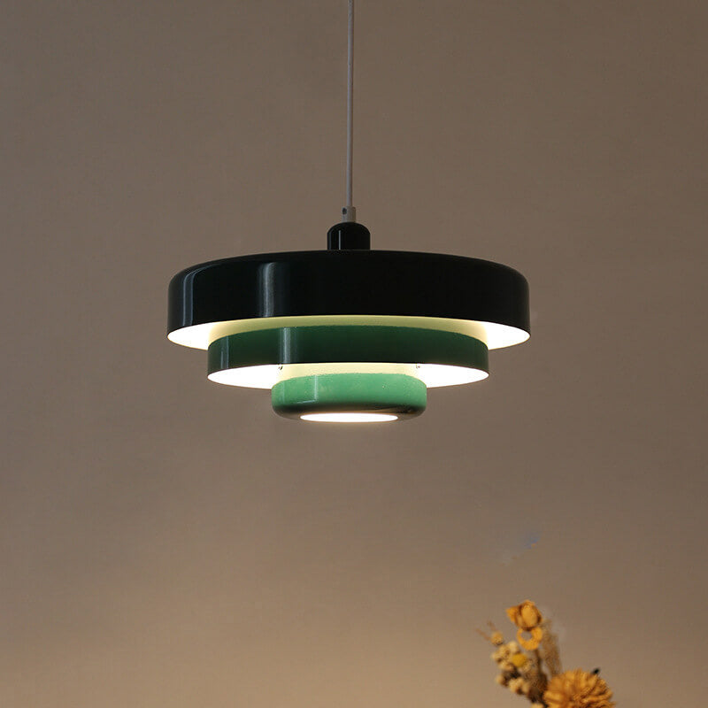 Layered pendant light in a bedroom