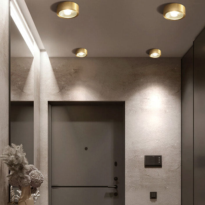 Copper flush ceiling light in a hallway