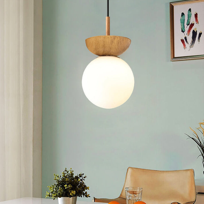 Glass orb pendant in wood finish