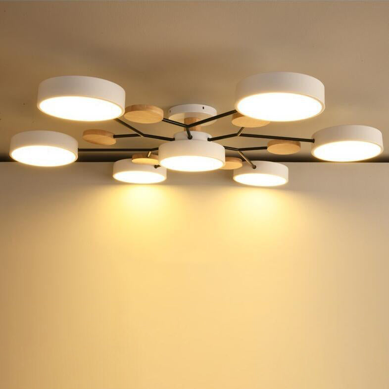 Molecule branch ceiling light over a dining table