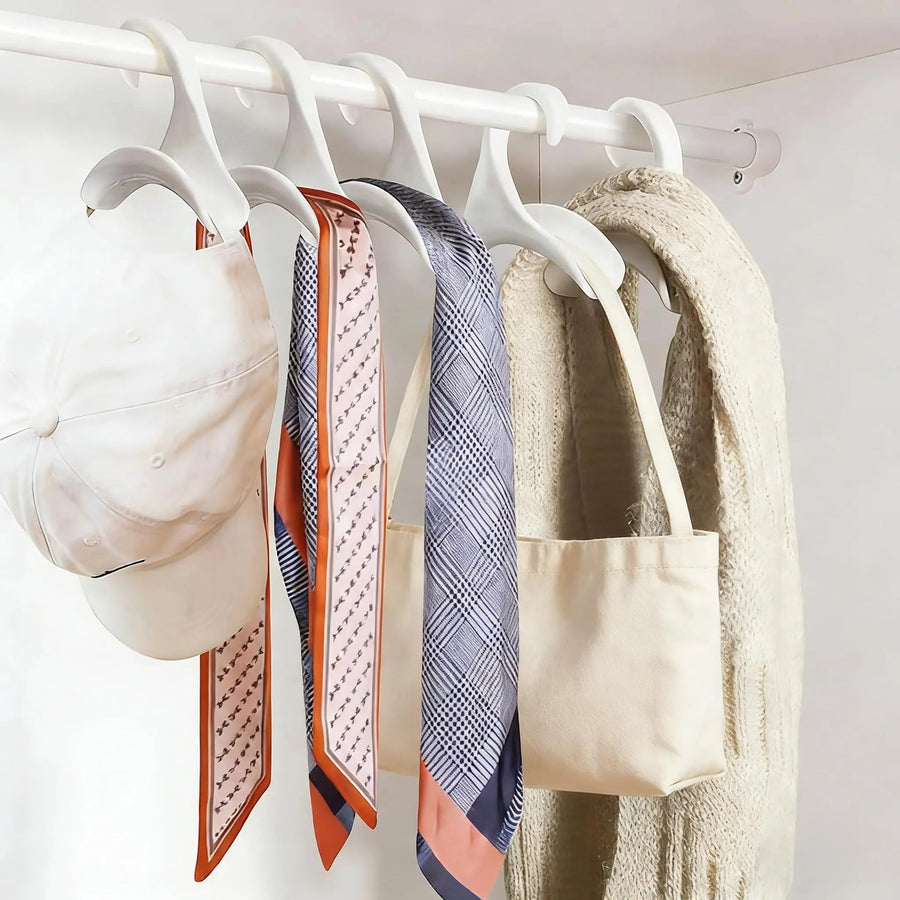 Arched steel bag hangers on a closet rod