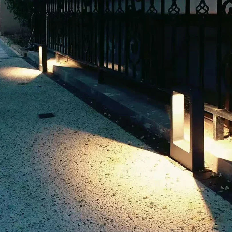 Garden bollard light in the lawn