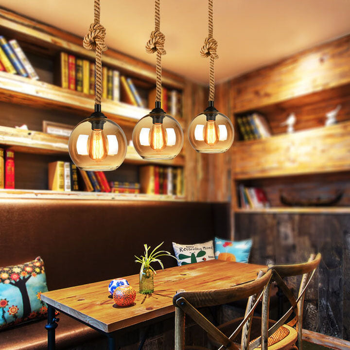 Glass globe pendant with filament bulb