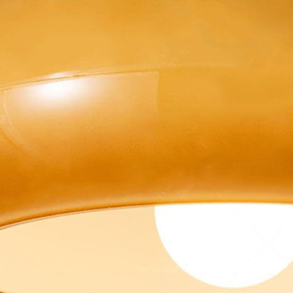 Round glass ceiling light in a room