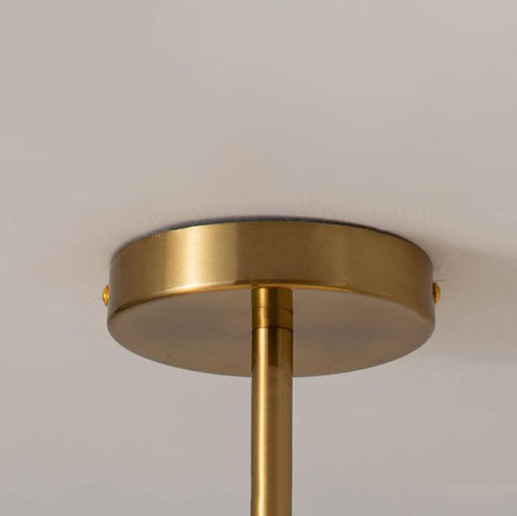 Round glass ceiling light in a hallway