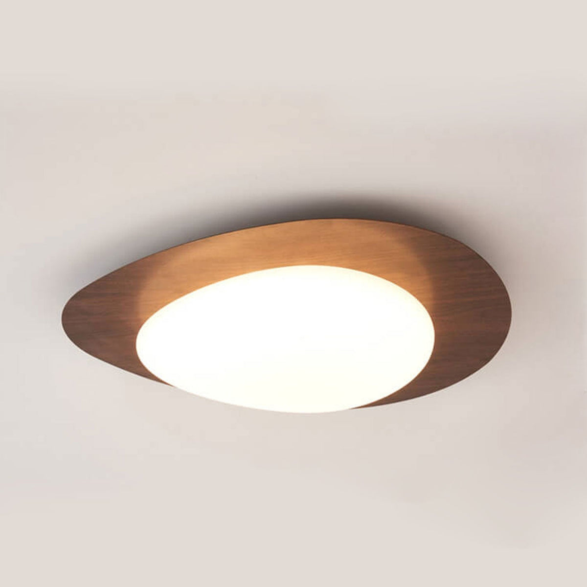 Pebble ceiling light in walnut grain