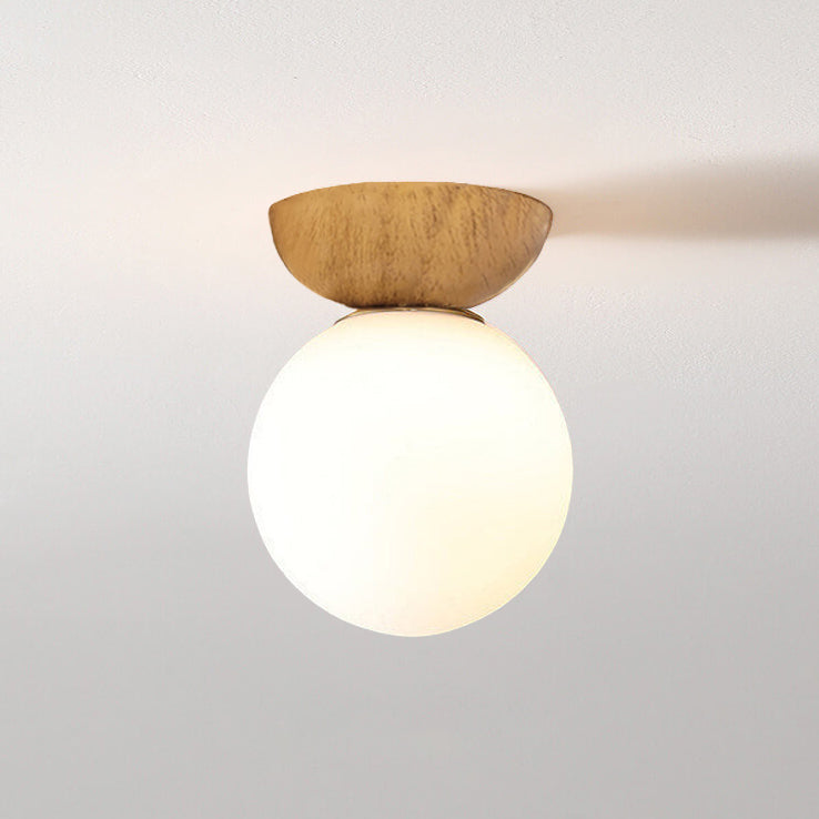 Glass orb light in a dining nook