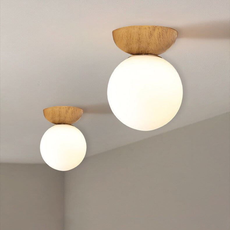 Glass orb semi-flush light in wood finish