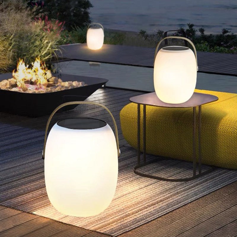 Solar basket lamp glowing at dusk
