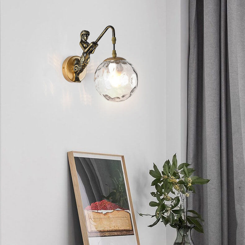 Gold mermaid wall light, clear orb