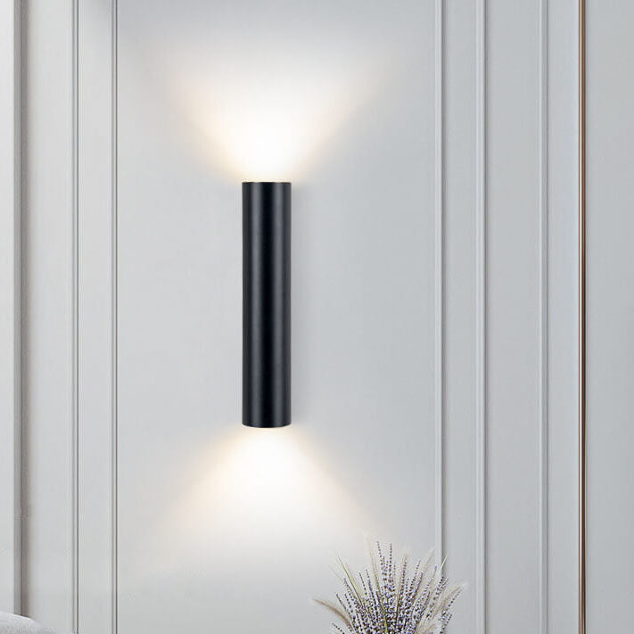 Black cylinder wall light, warm white