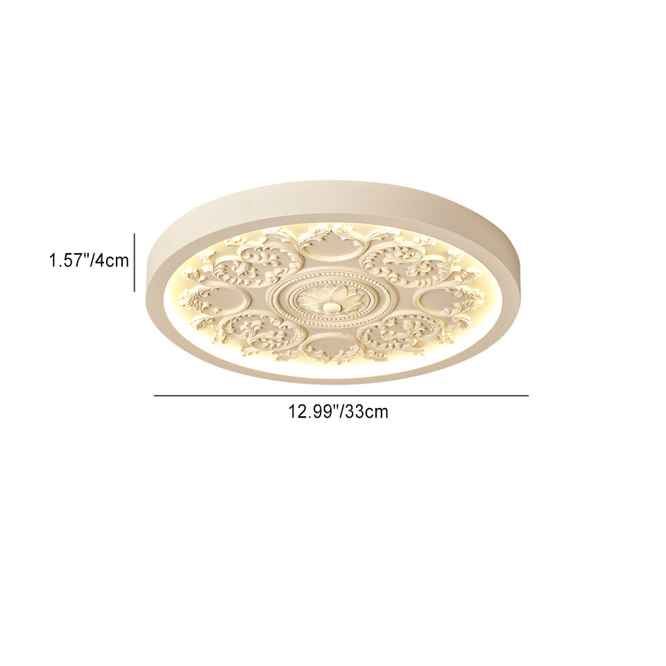 Carved resin flush ceiling light in a bedroom