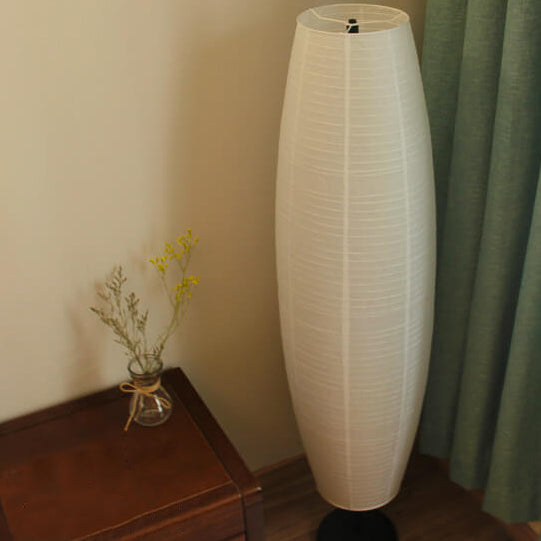 Rice paper floor lamp beside a sofa