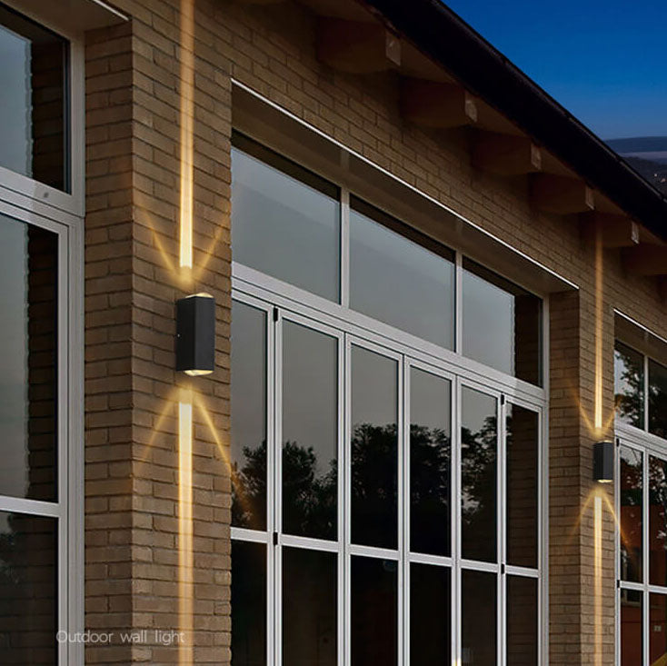 Rectangular outdoor wall light lit at night