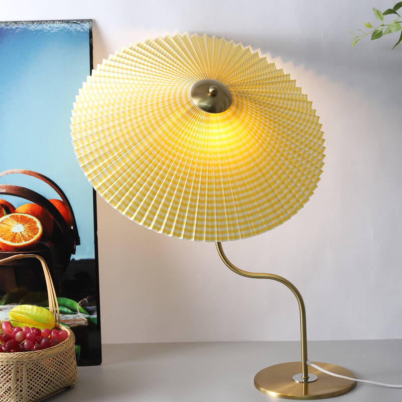 Pleated umbrella table lamp in a bedroom