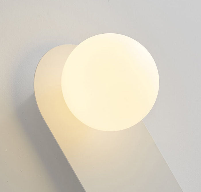 Glass ring wall light in a hallway