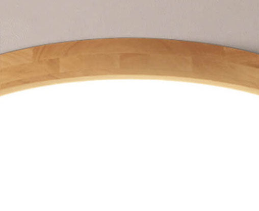 Round wood ceiling light in a hallway