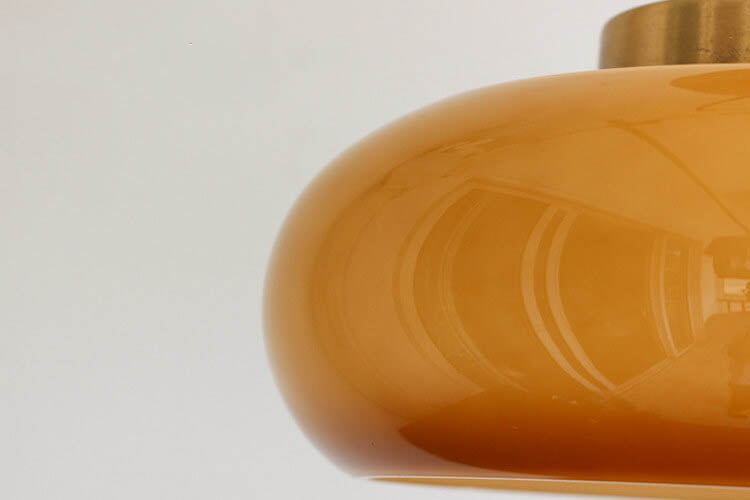 Amber glass ceiling light in a bedroom