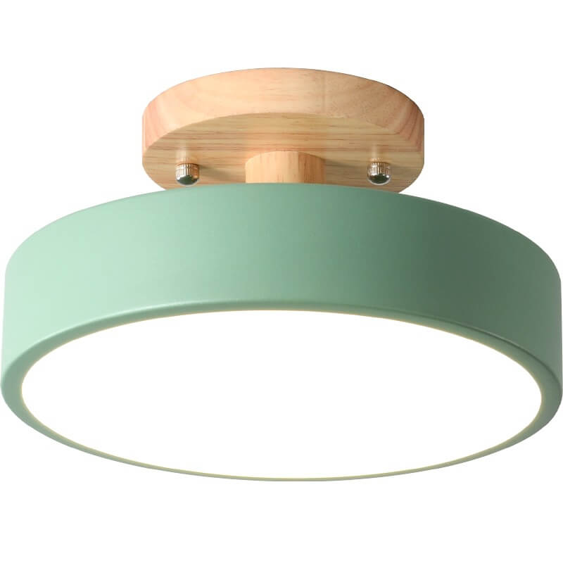 Round wood-look ceiling light lit
