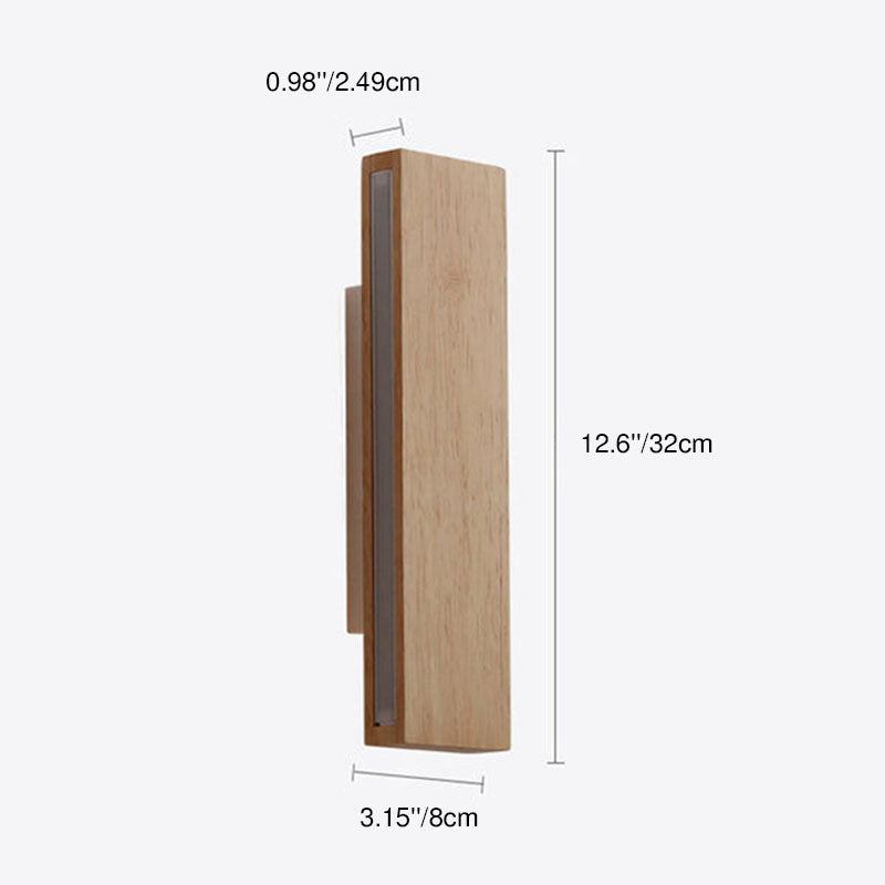 Wood wall light lit at night