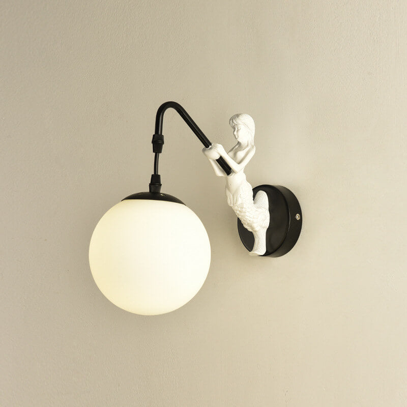 Black mermaid wall light with white glass orb