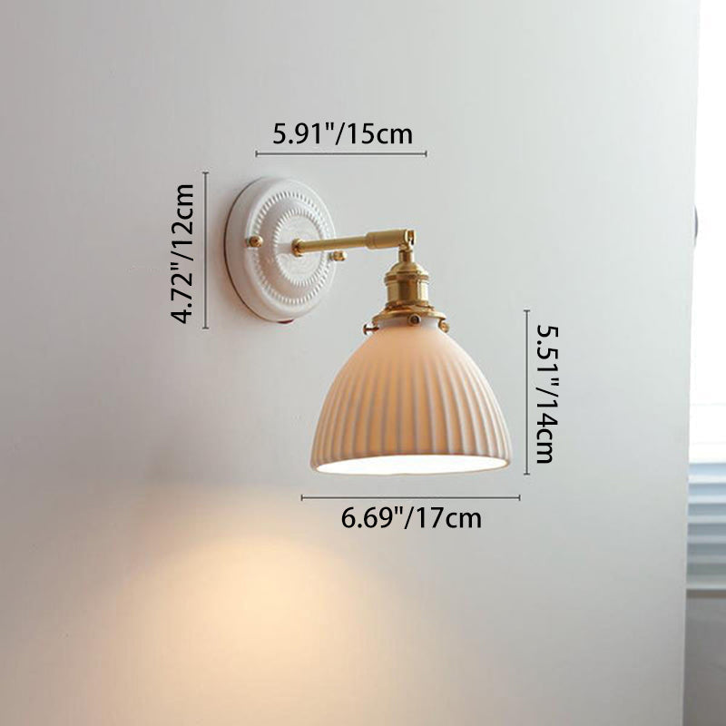 Ceramic wall light lit at night