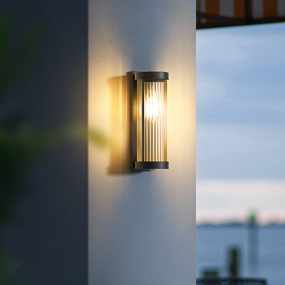 Cylinder outdoor wall lamp on a house wall