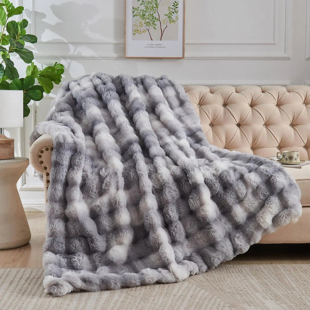 Tie dye faux fur throw draped on sofa
