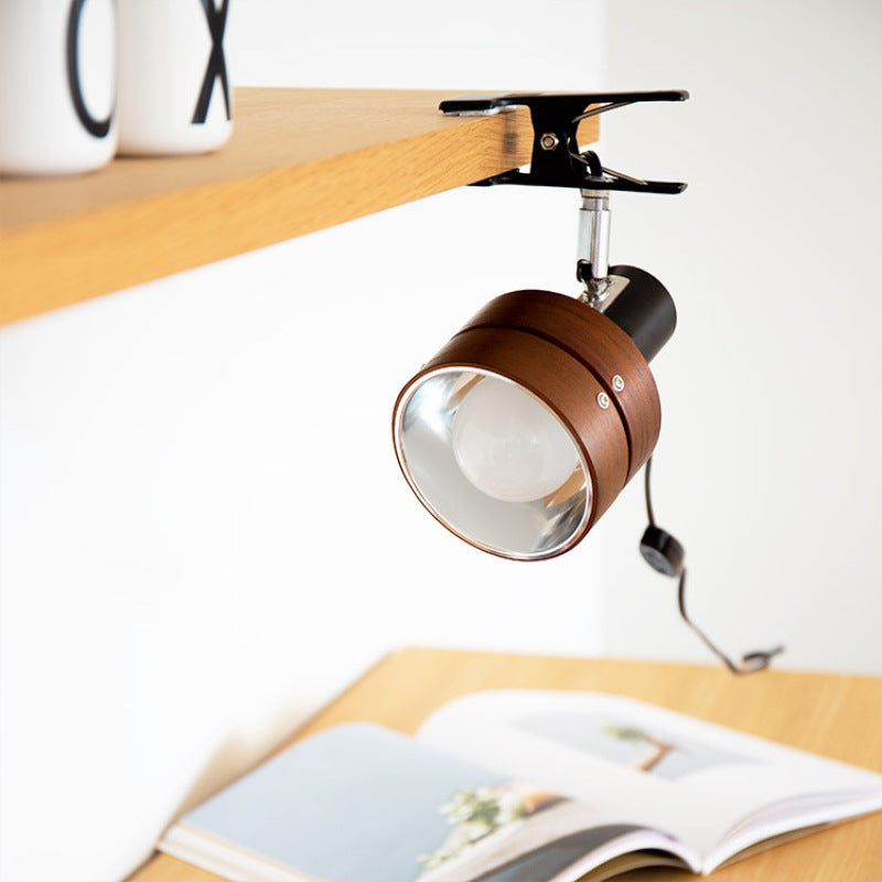 Wood clip lamp on a headboard