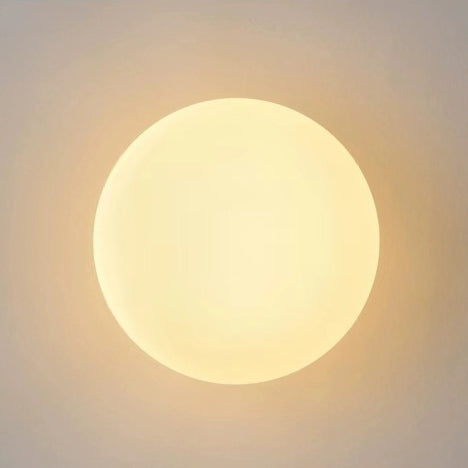 Glass orb wall light installation