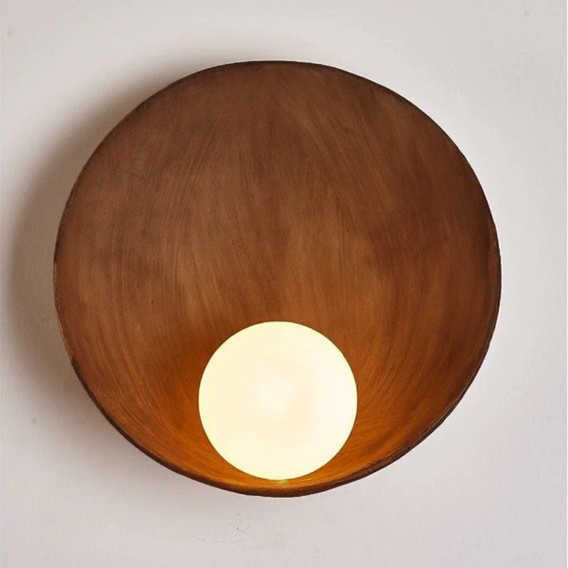 Round resin wall light in wood finish, detail
