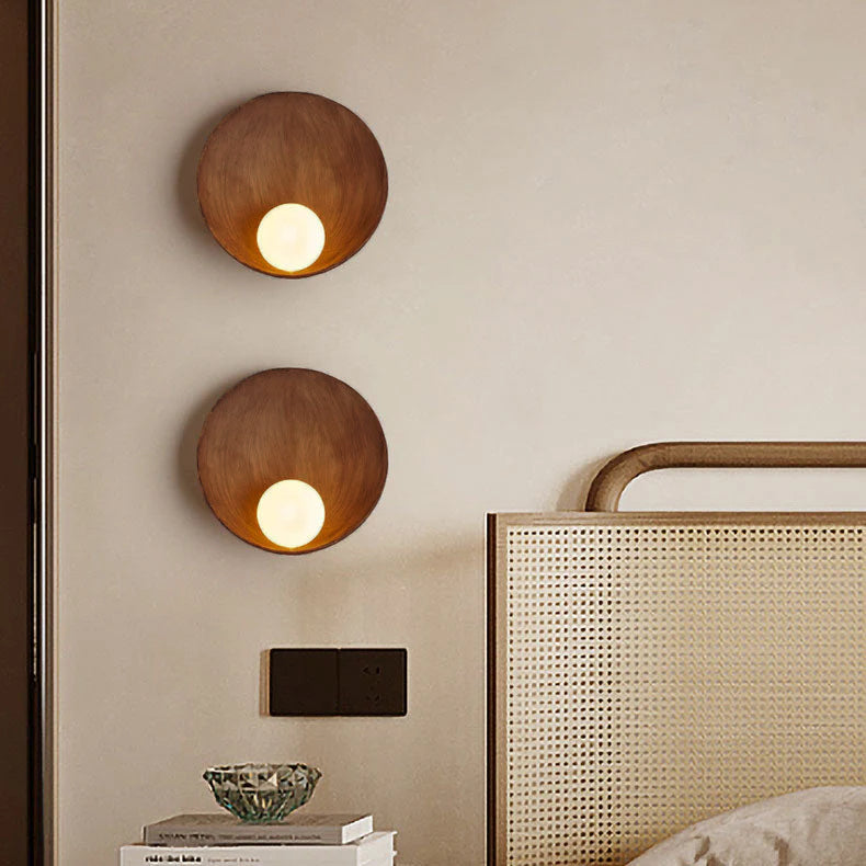 Round resin wall light in wood finish