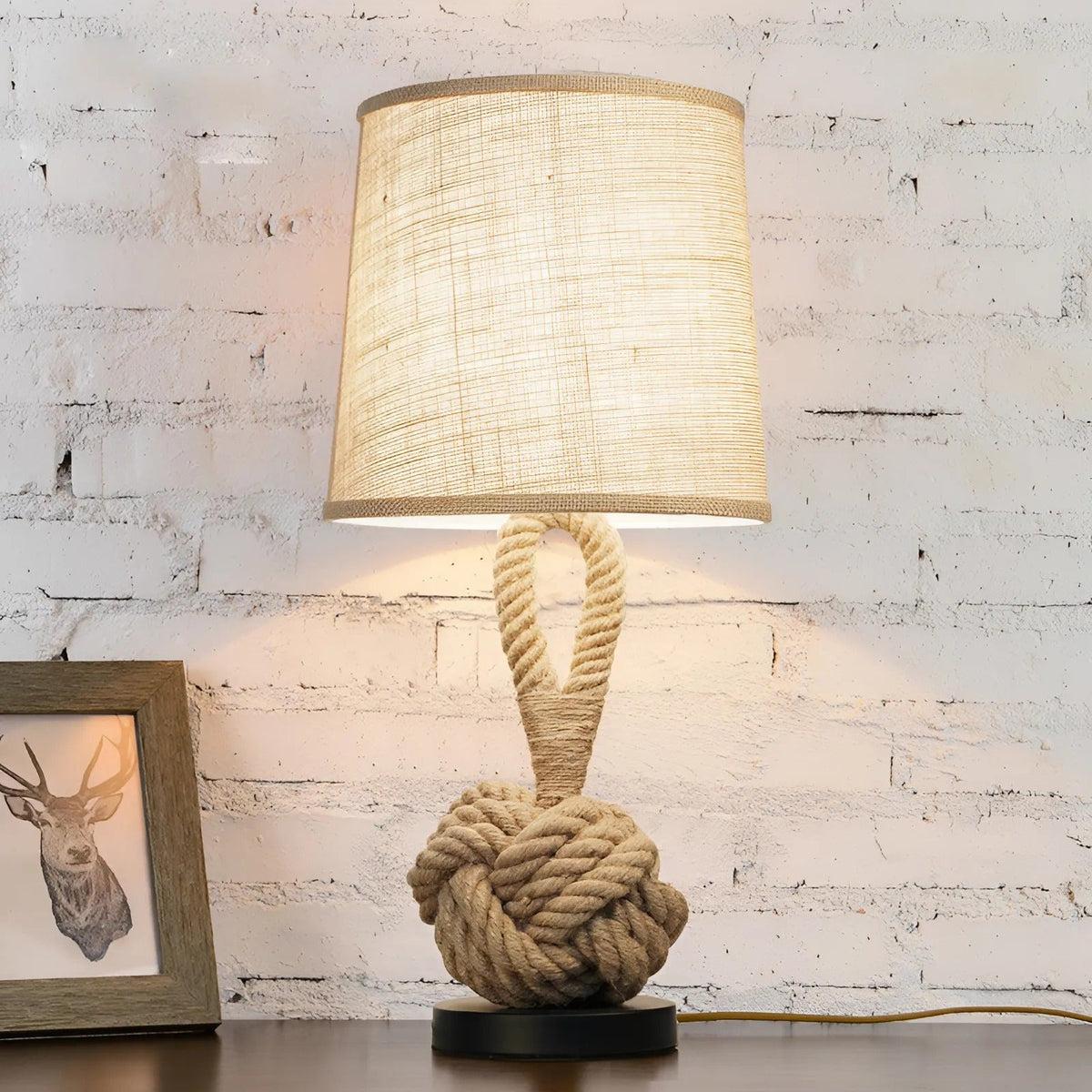 Coastal rope lamp with linen shade lit