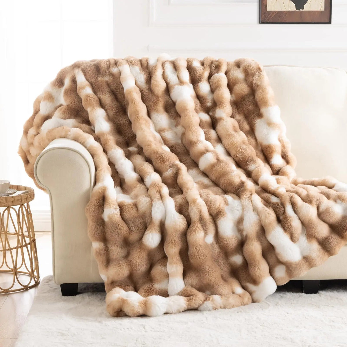 Tie dye faux fur blanket on a bed