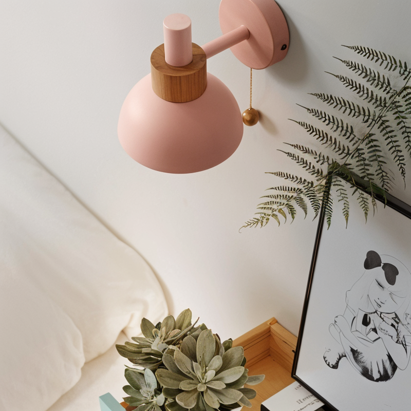 Pastel wall lamp lit beside a bed