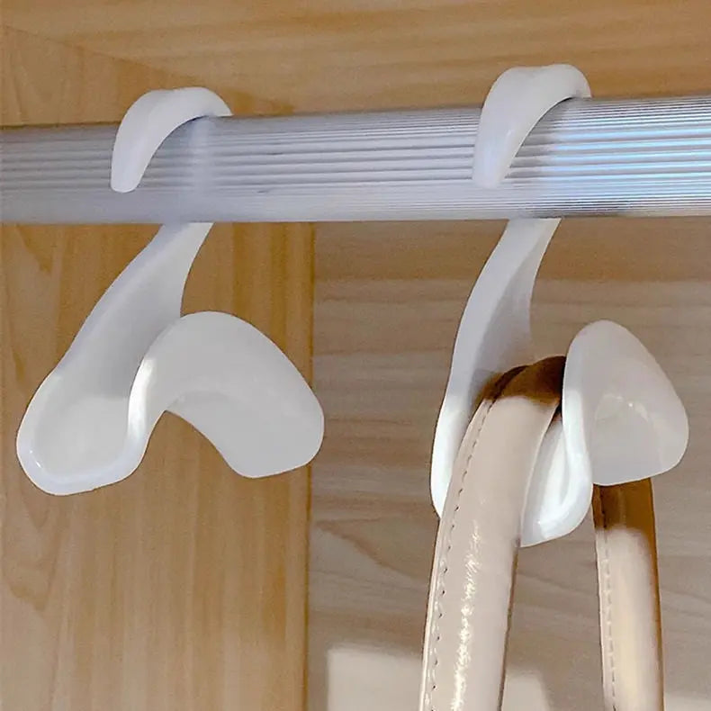 Set of steel bag hangers in a wardrobe
