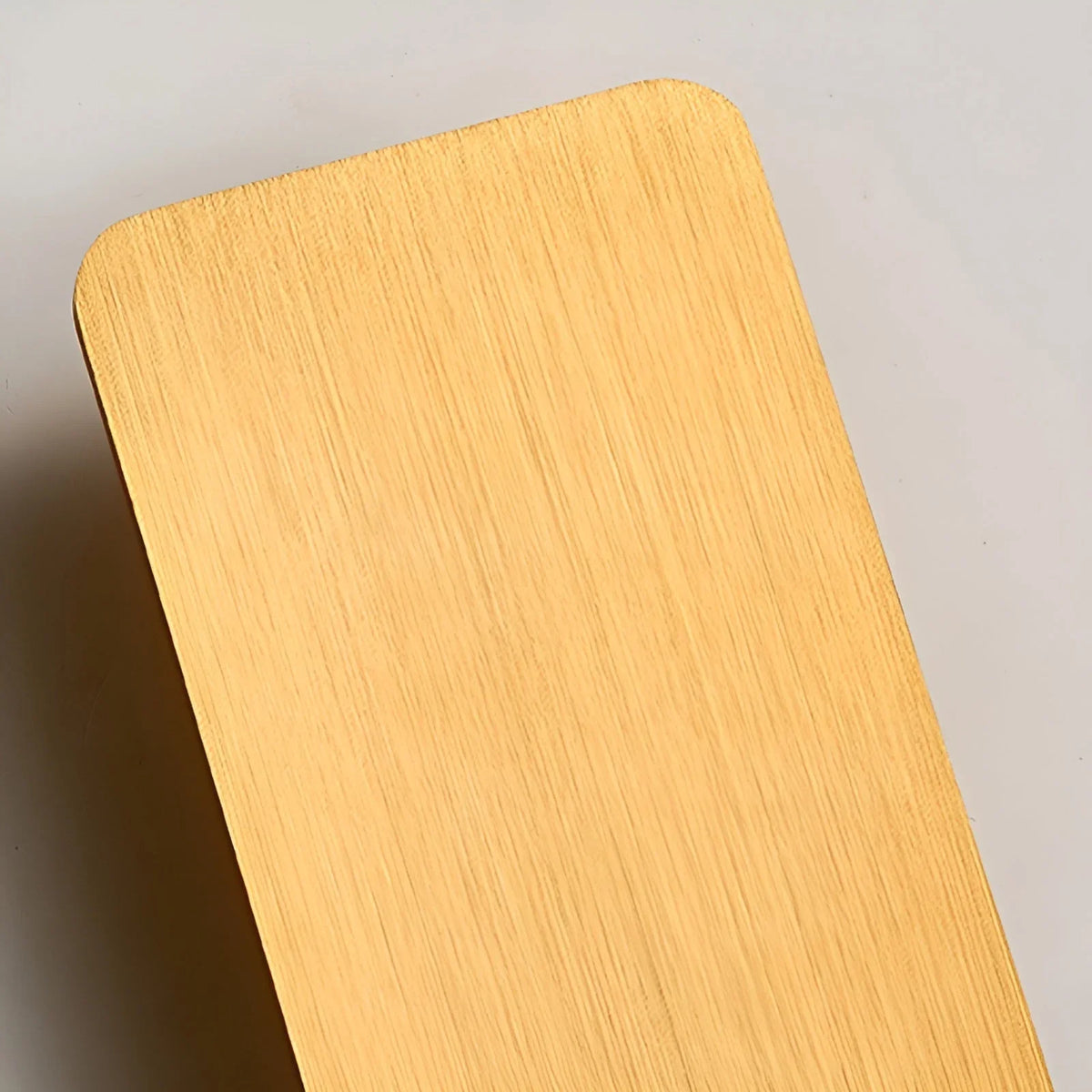 Rectangular LED wall sconce beside a bed