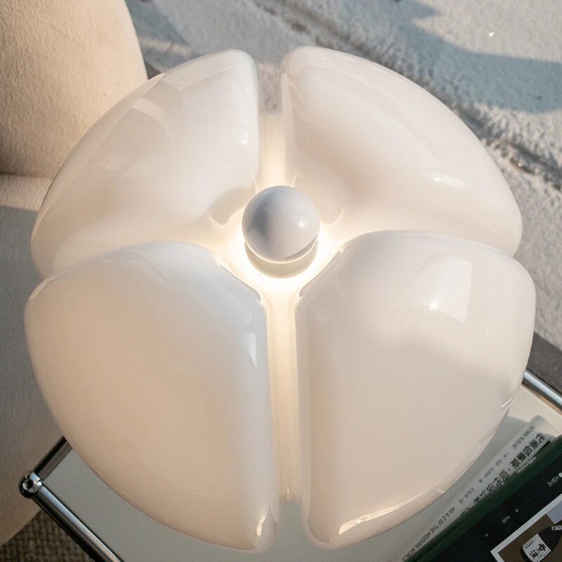 Flower table lamp on a bedside table