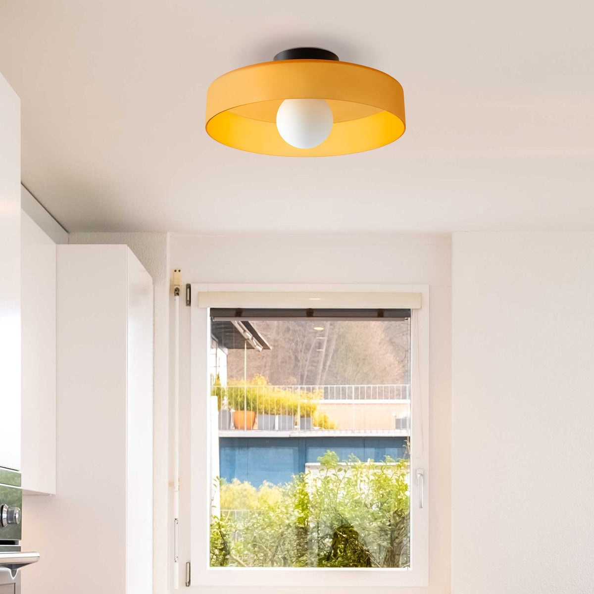 Round glass ceiling light lit