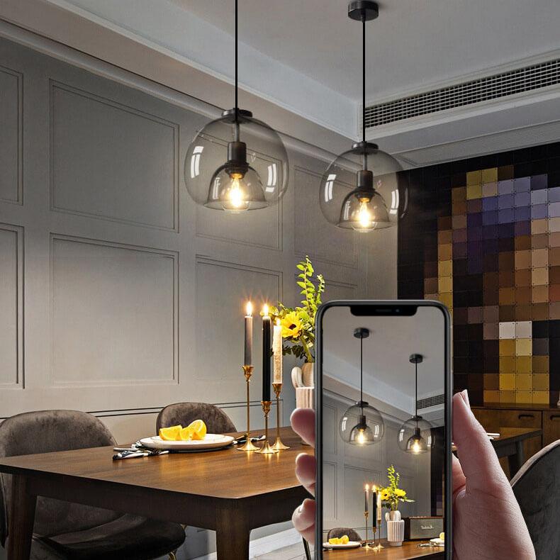 Glass dome pendant over a kitchen island