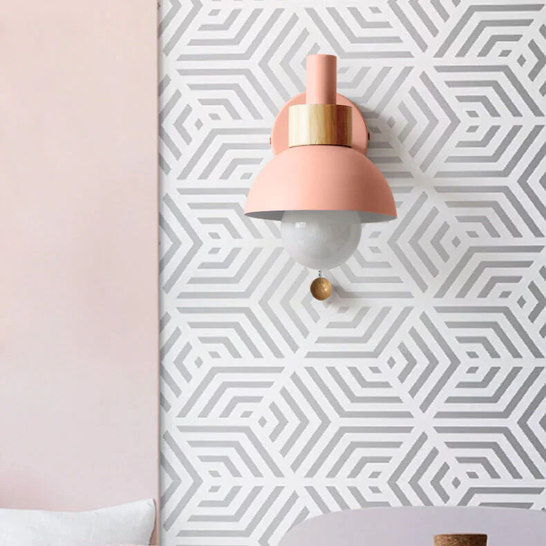 Wall lamp lit in a cosy room