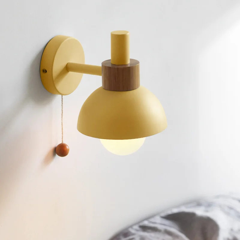 Yellow wood and iron wall lamp