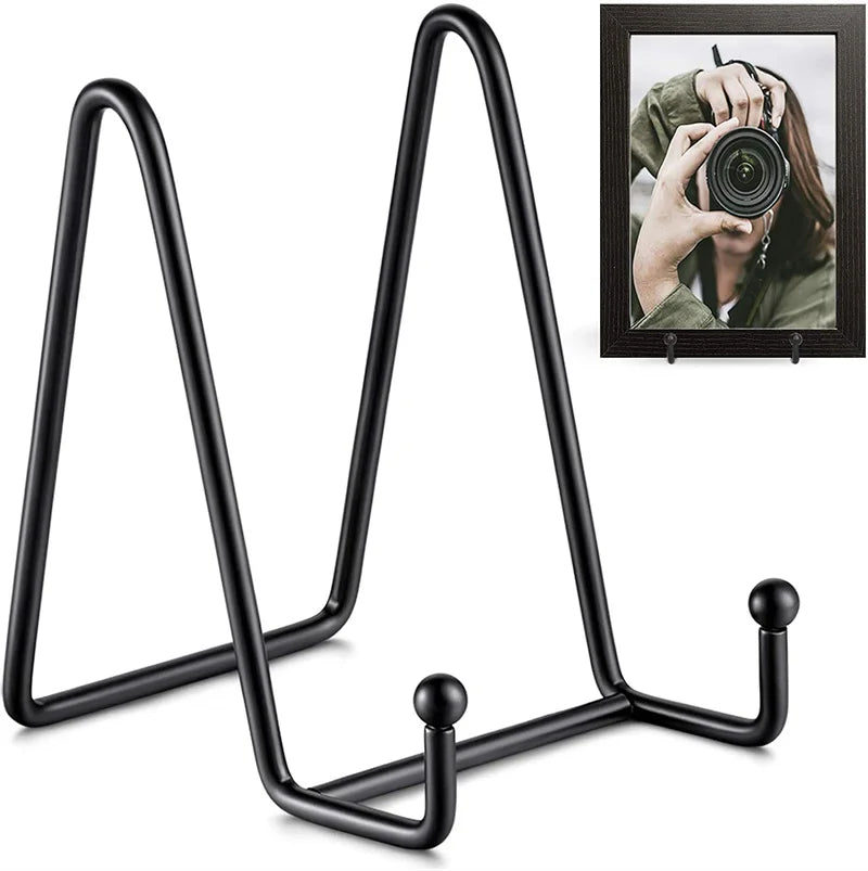 Iron easel display stand holding a decorative plate